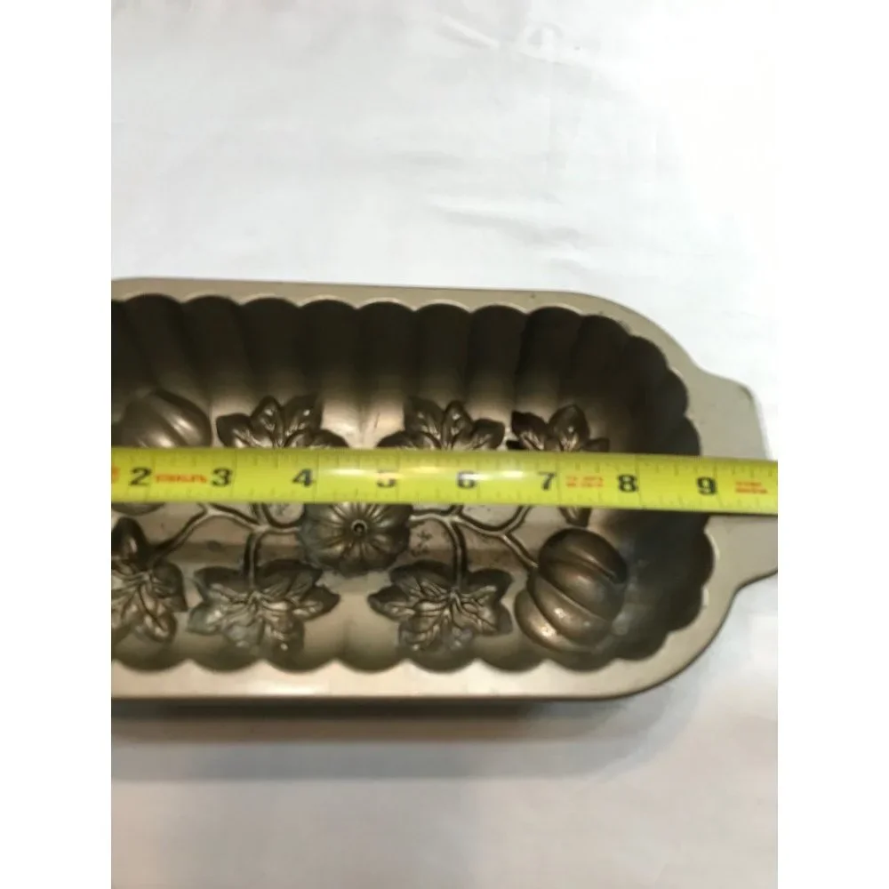 Nordic Ware 13”x61:2” cast aluminum pumpkin patch loaf pan. Made U.S.A.